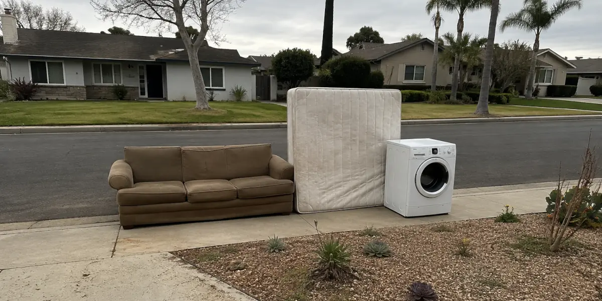 Couch, mattress and washer set out for furniture and appliance removal in Brea