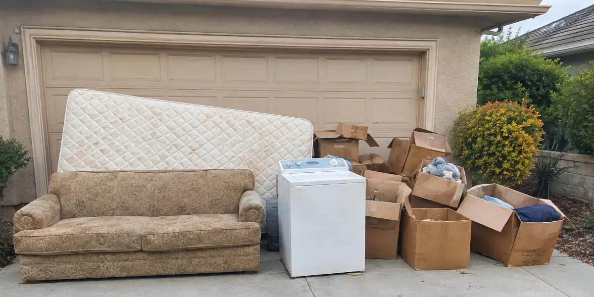 Pile of junk removed in Brea CA — couch, mattress, boxes and a washer